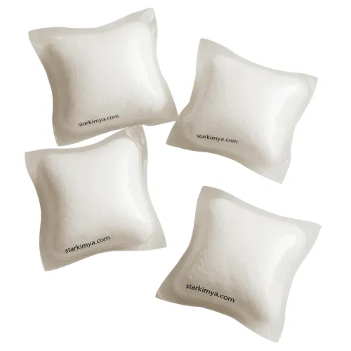 Water-soluble dishwasher pods in clear PVA film filled with white detergent powder, eco-friendly cleaning solution
